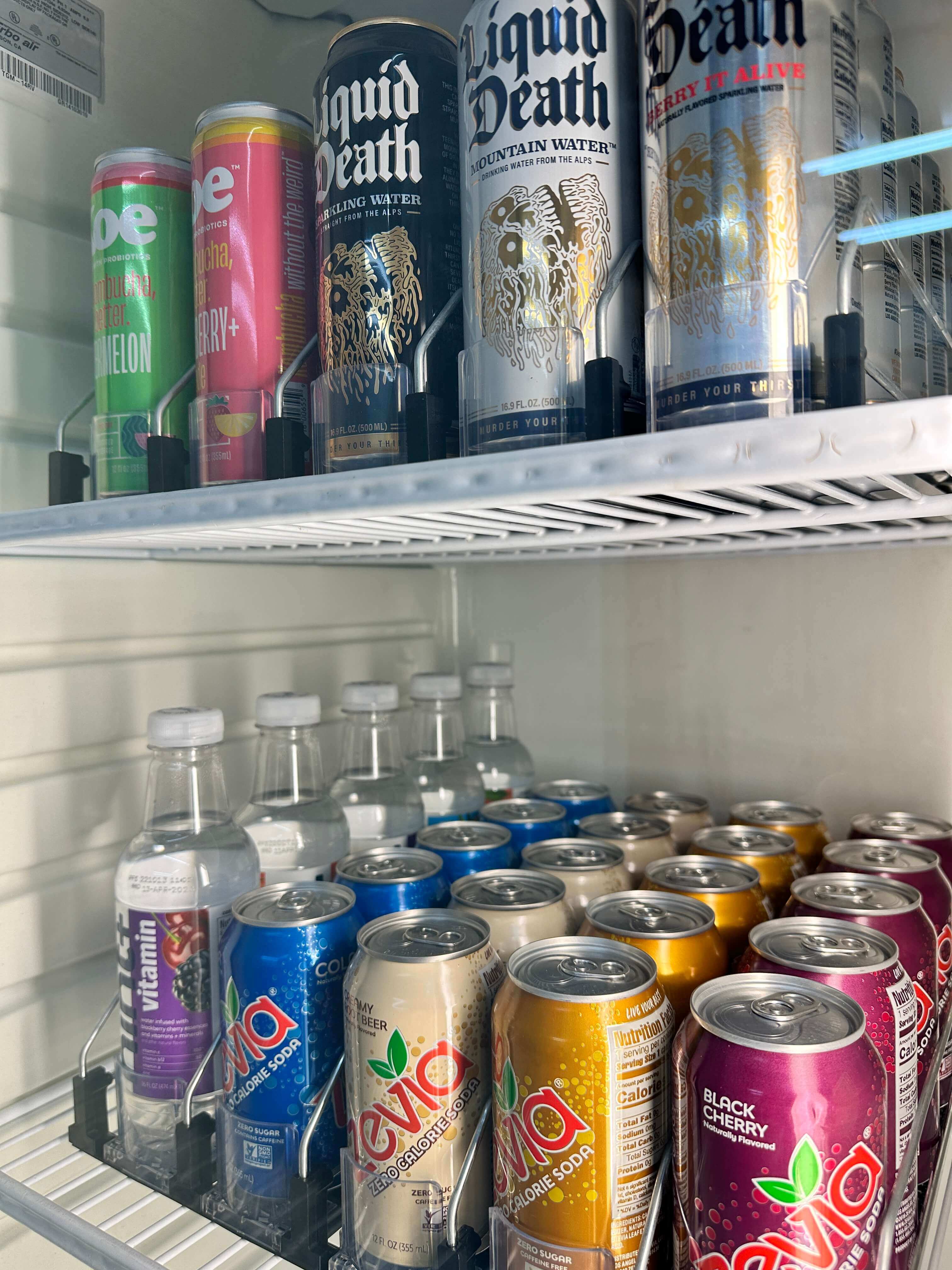 a photo of the kitchen: fridge, coffee maker, snacks